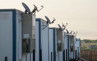 Modular building units with satellite dishes